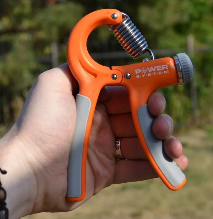 Эспандер кистевой Power System PS-4021 с регулируемой нагрузкой 10-40 кг. Power Hand Grip Orange