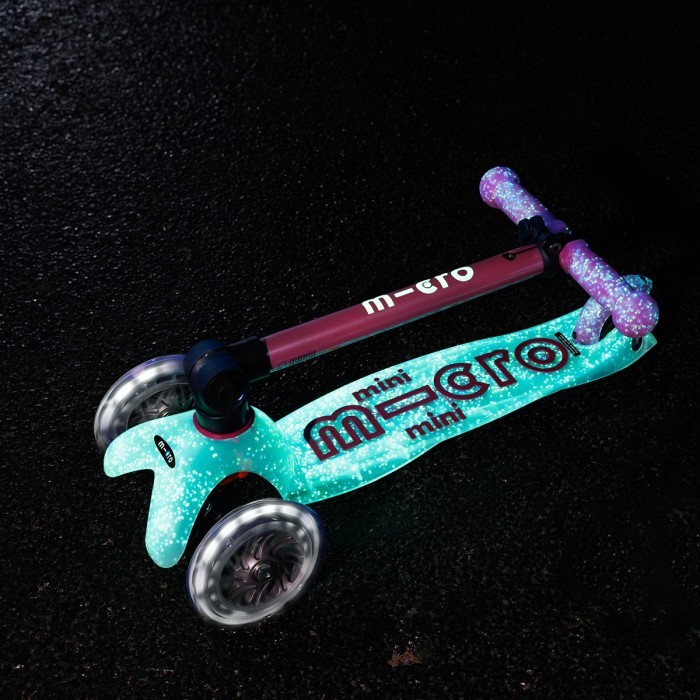 Самокат MICRO серии "Mini Deluxe Foldable Orion Glow LED" – Розовый (сложный, до 50 кг (kg), трехколесный)