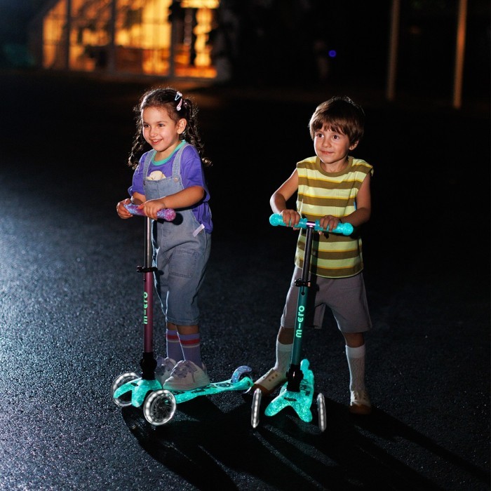 Самокат MICRO серии "Mini Deluxe Foldable Orion Glow LED" – Розовый (сложный, до 50 кг (kg), трехколесный)